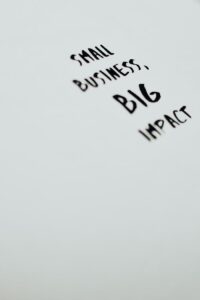 pexels-photo-7661288 A motivational quote highlighting the impact of small businesses on a minimalist background.